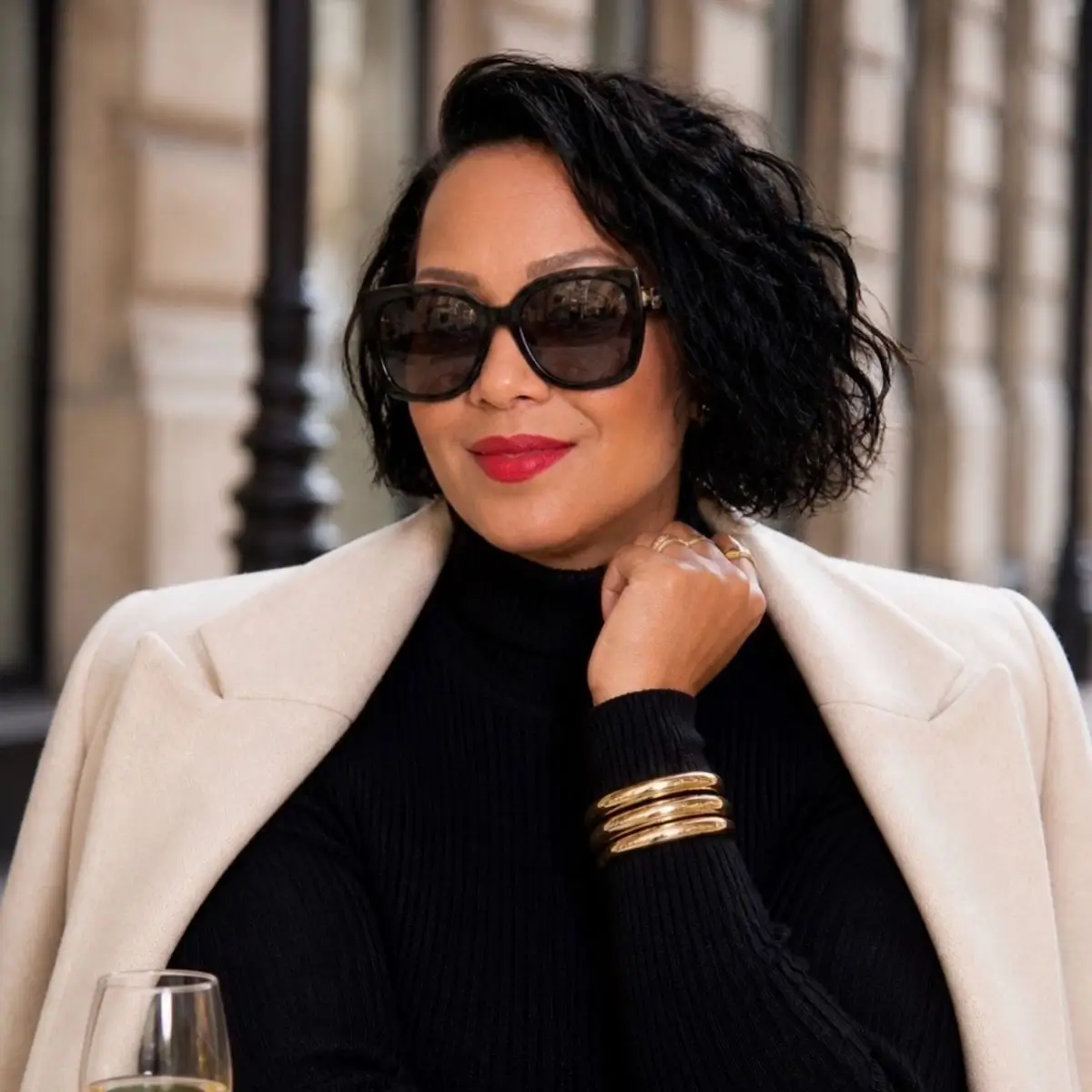 Leah Carter sitting confidently at a successful business meeting, representing a powerful woman entrepreneur building a million-dollar business through leadership, strategy, and innovation.
